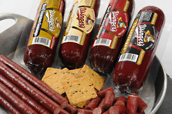 summer sausages and snack sticks with crackers in a tray