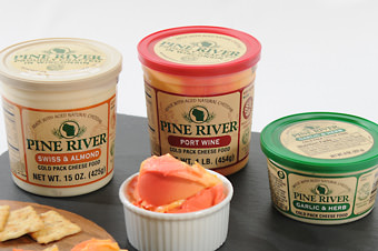 3 containers of spread with crackers